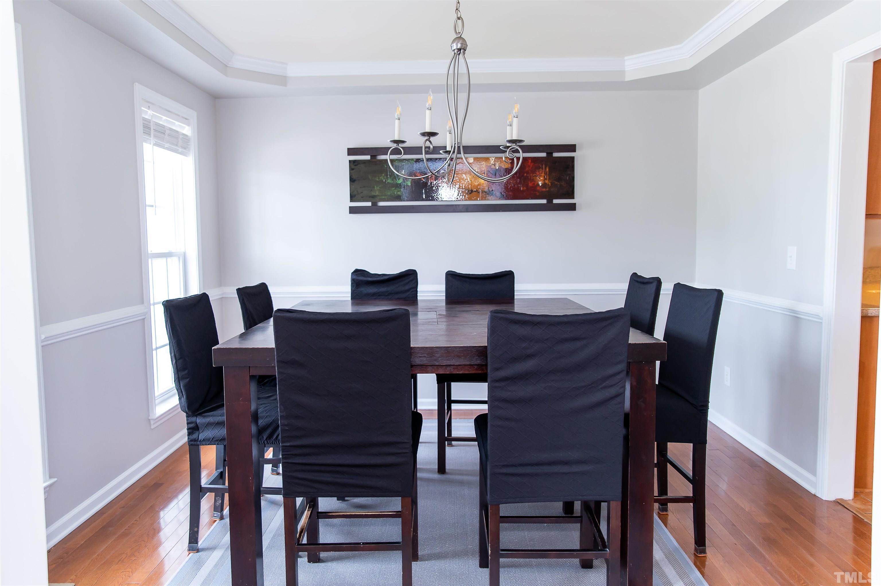 917 Pristine Lane Rolesville, NC 27571 - Photo 5 of 35 a view of a dining room with furniture and wooden floor