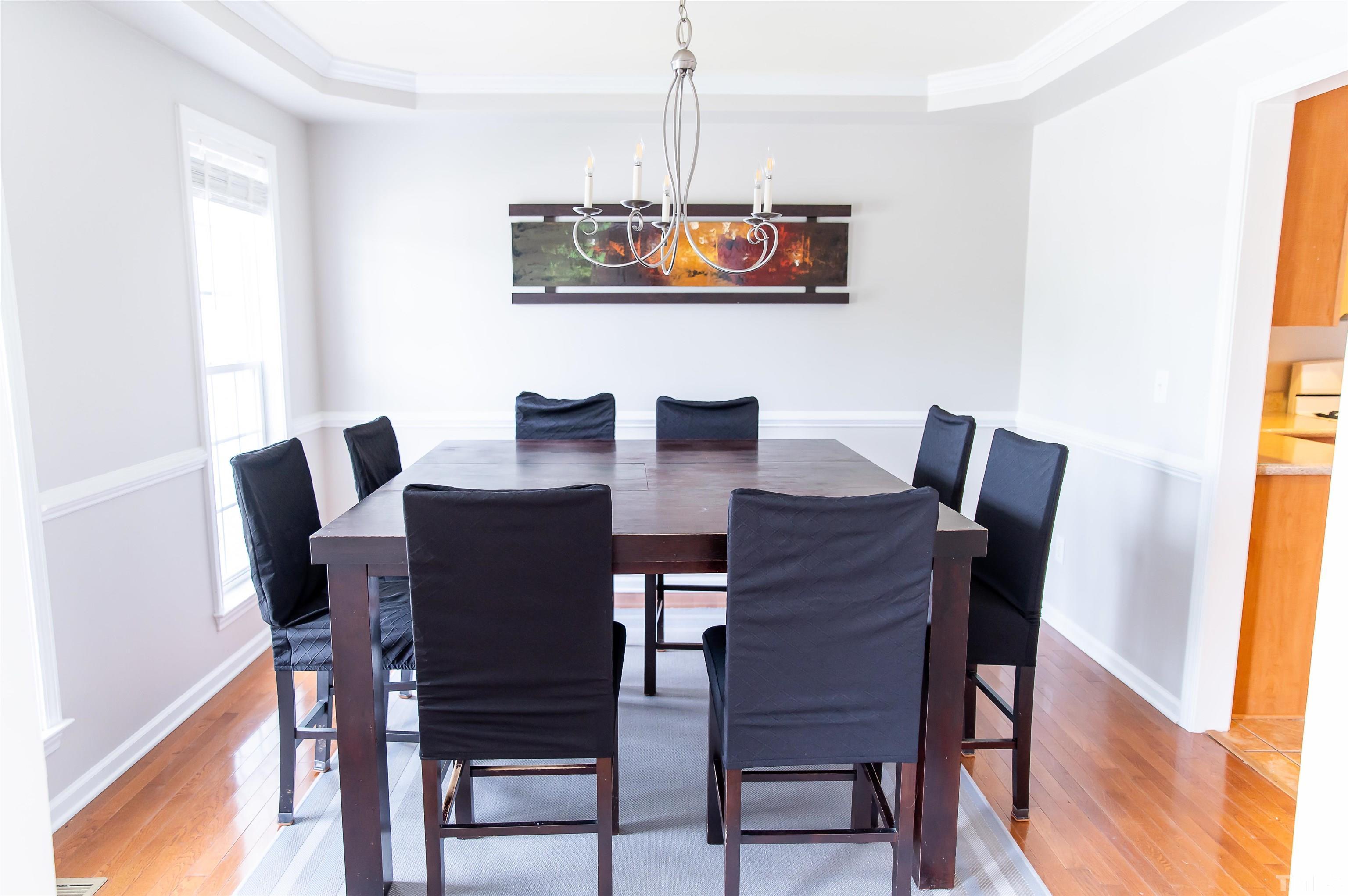 917 Pristine Lane Rolesville, NC 27571 - Photo 6 of 35 a view of a dining room with furniture and wooden floor