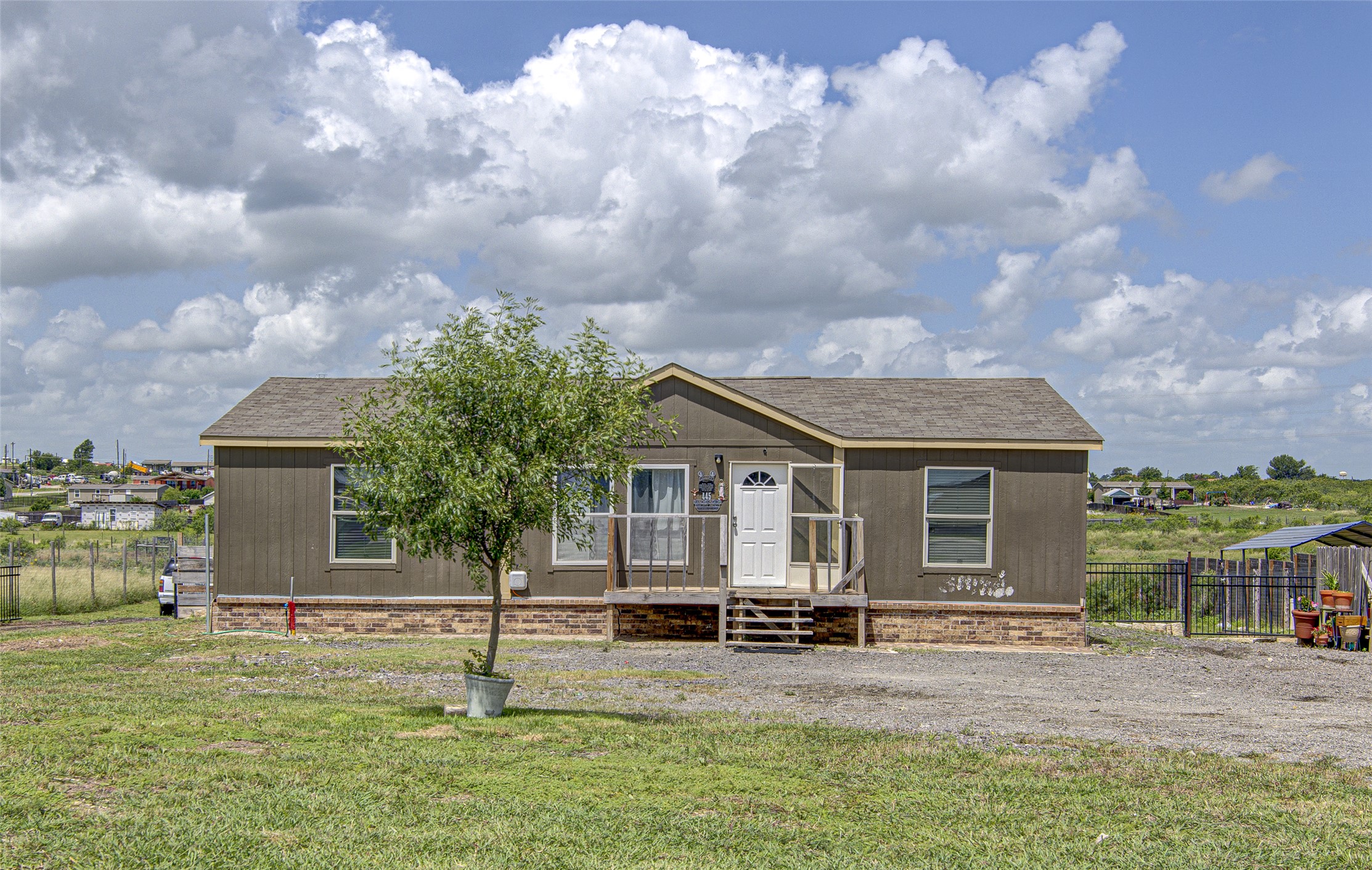 A well-maintained home awaits, featuring a welcoming entrance and ample outdoor space.