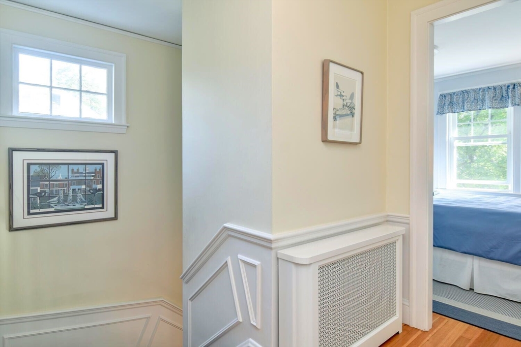 15 Selden Street Newton, MA 02468 - Photo 17 of 33 a view of hallway with window and a ceiling fan