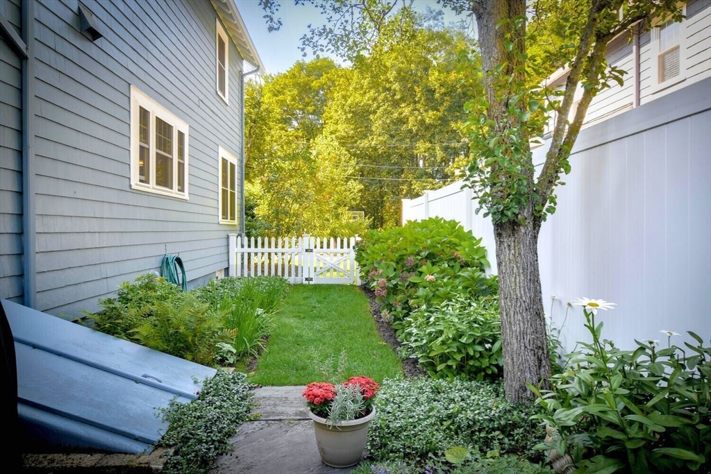 15 Selden Street Newton, MA 02468 - Photo 28 of 33 a view of a backyard with potted plants and a fountain