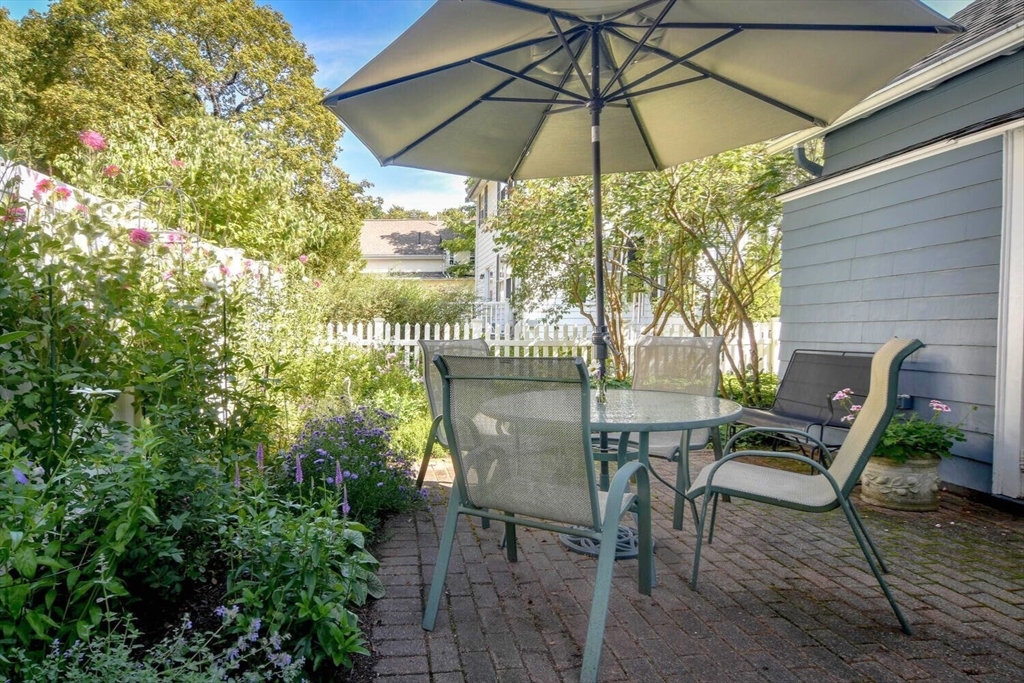 15 Selden Street Newton, MA 02468 - Photo 29 of 33 a view of table and chairs under an umbrella