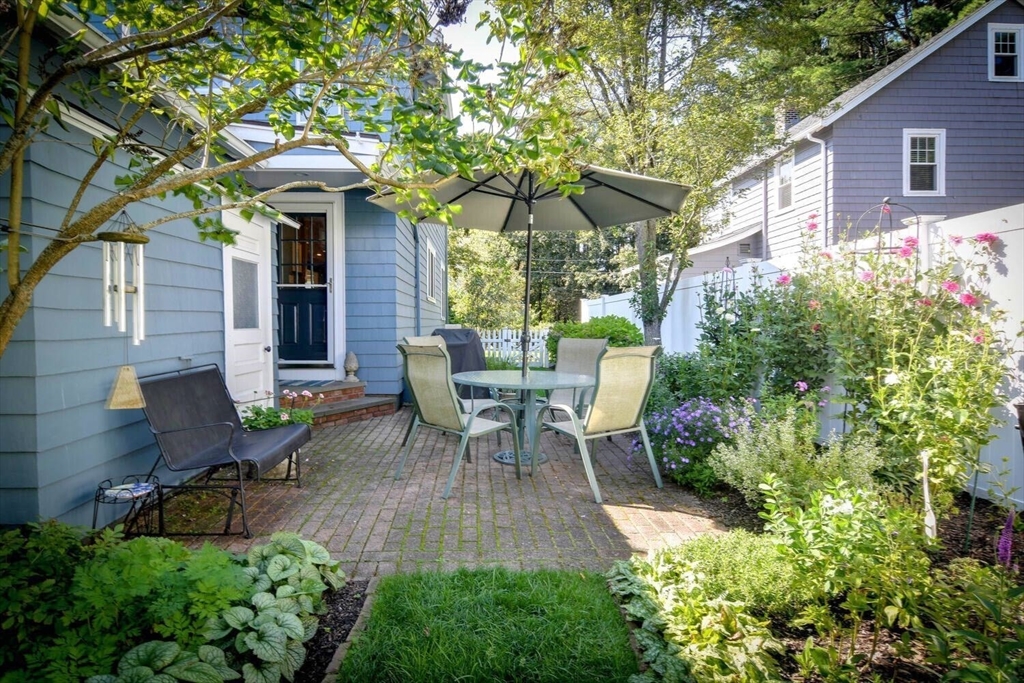 15 Selden Street Newton, MA 02468 - Photo 31 of 33 a view of a chair and table in backyard of the house