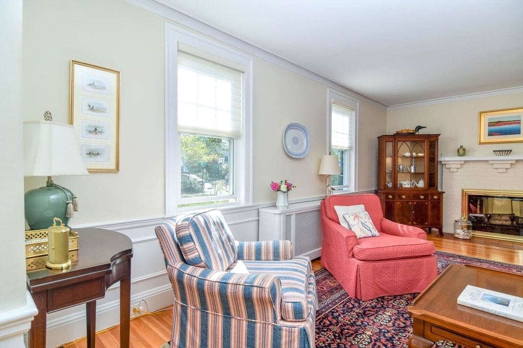 15 Selden Street Newton, MA 02468 - Photo 5 of 33 a living room with furniture a fireplace and a window
