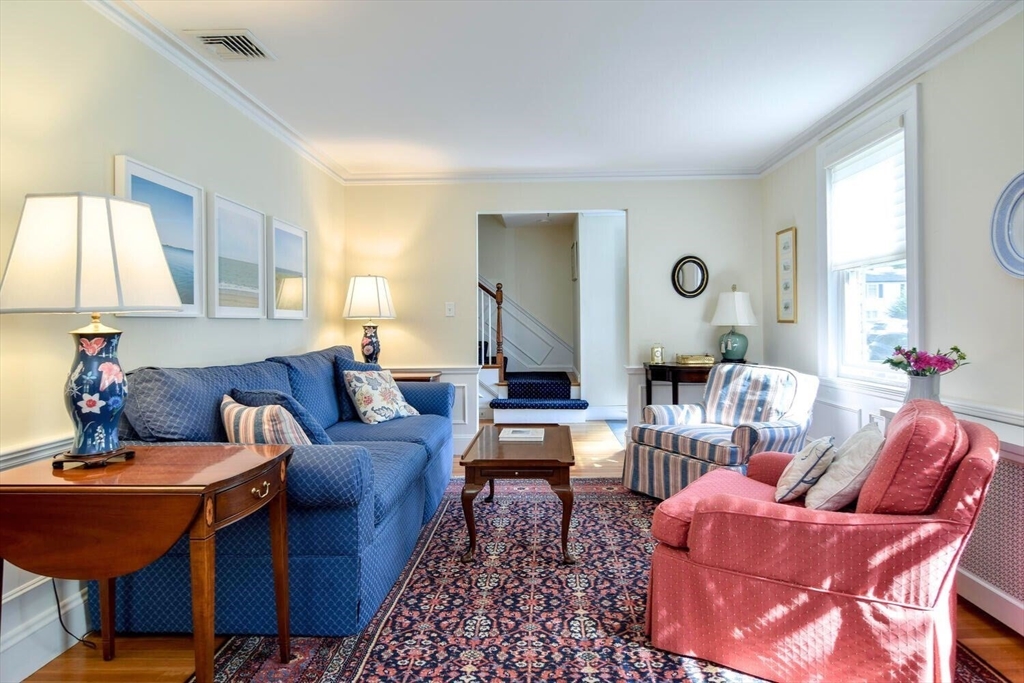 15 Selden Street Newton, MA 02468 - Photo 7 of 33 a living room with furniture a large window and a lamp