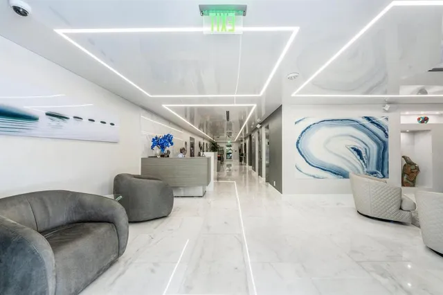 a view of a livingroom with furniture and a window