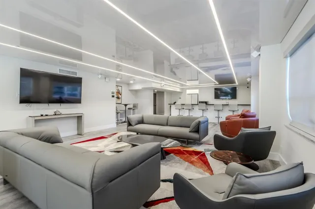 an aerial view of a house with a swimming pool