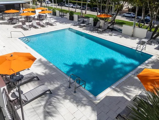 a view of pool with outdoor seating