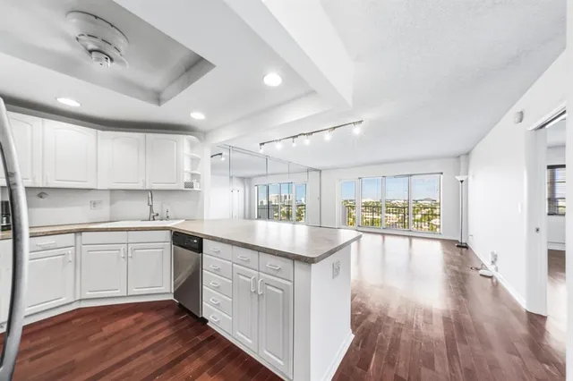 a kitchen with a sink and cabinets