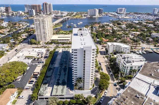 an aerial view of residential building with outdoor space and lake view