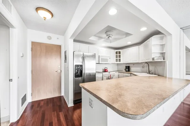 a view of a livingroom with wooden floor
