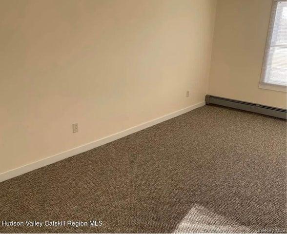 254 Partition Street, Unit 252 Saugerties, NY 12477 - Photo 6 of 11 an empty room with a window
