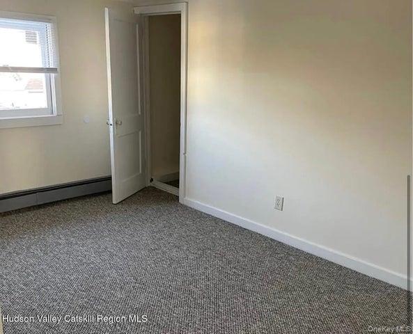 254 Partition Street, Unit 252 Saugerties, NY 12477 - Photo 10 of 11 an empty room with windows