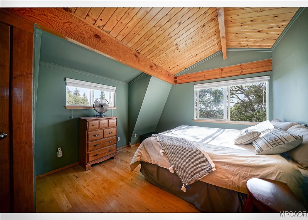 33469 Music Camp Road Running Springs, CA 92382 - Photo 17 of 27 a bedroom with a bed and window