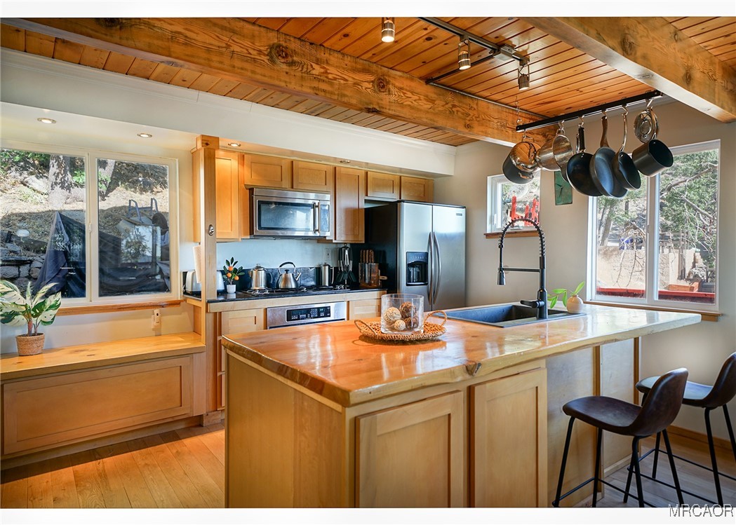 33469 Music Camp Road Running Springs, CA 92382 - Photo 6 of 27 a kitchen with a sink and cabinets