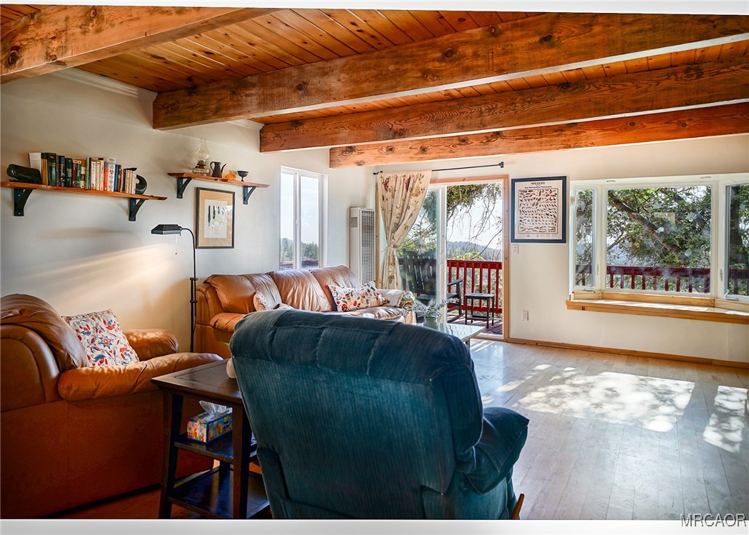 33469 Music Camp Road Running Springs, CA 92382 - Photo 7 of 27 a living room with furniture and a floor to ceiling window