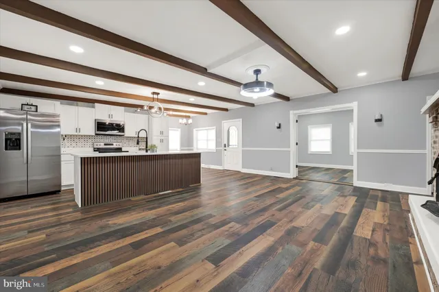 a view of kitchen with cabinets and stainless steel appliances