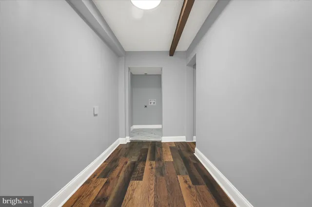 a view of a room with wooden floor and staircase