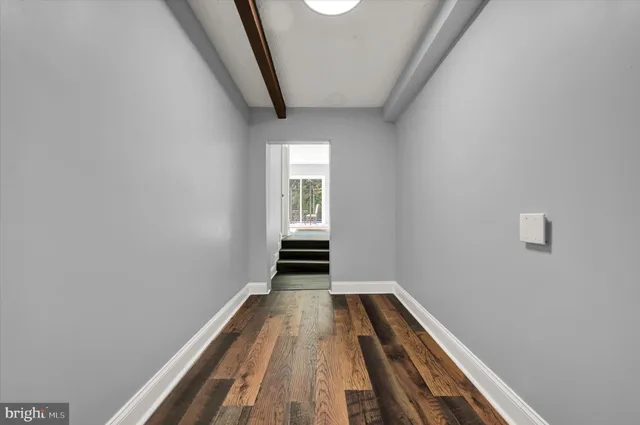a view of wooden floor in an empty room