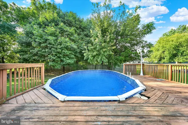a view of balcony with wooden floor and fence