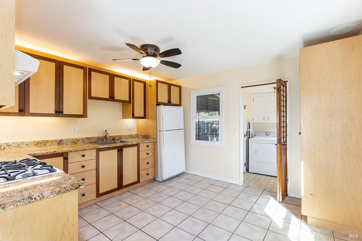 18090 Las Lomas Road Sonoma, CA 95476 - Photo 32 of 37 a kitchen with stainless steel appliances granite countertop a refrigerator and a stove top oven