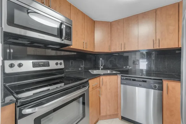a kitchen with a stove and a microwave