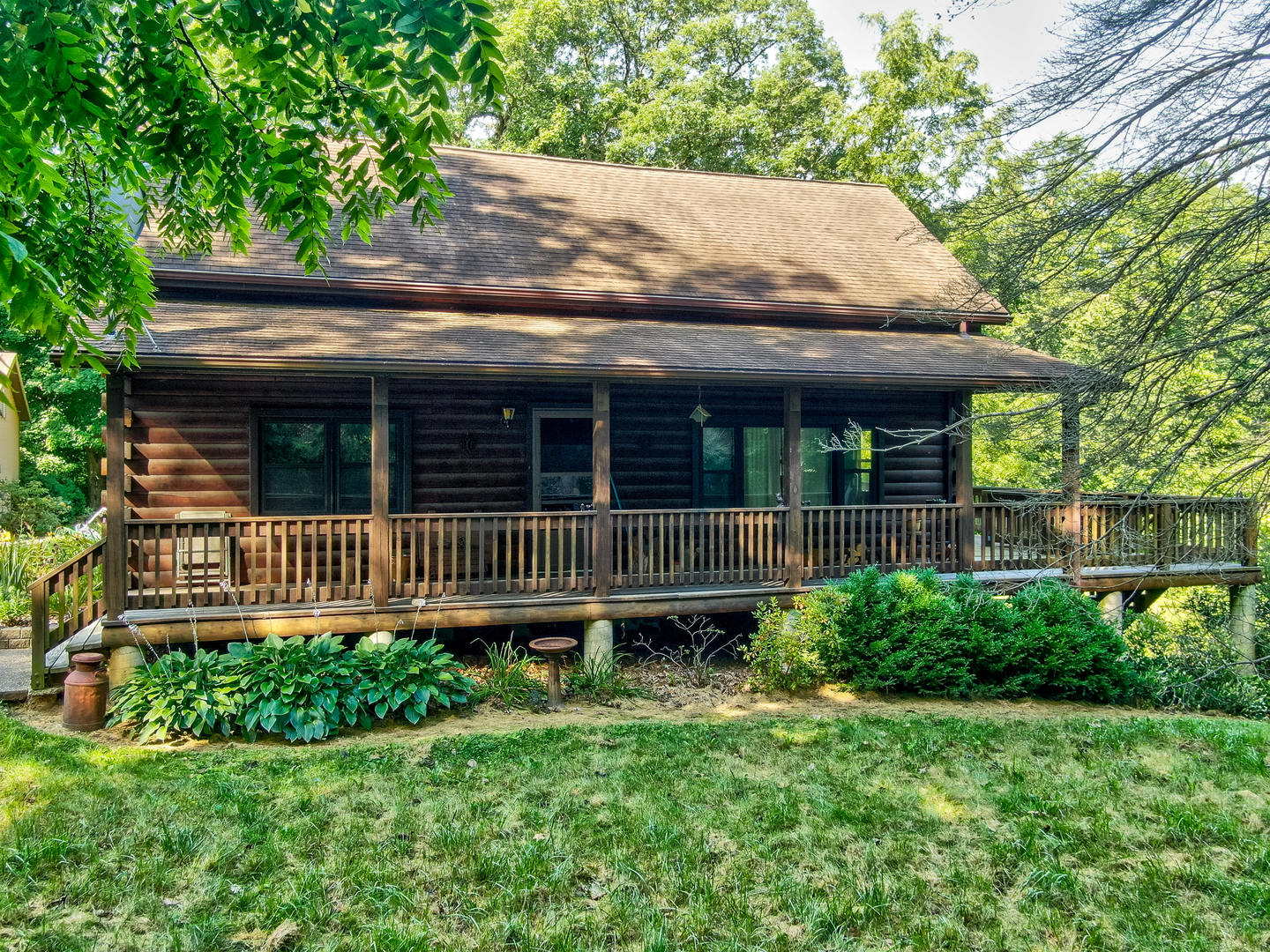 1901 East 1251st Road Streator, IL 61364 - Photo 22 of 32 a backyard of a house with a small deck and large tree