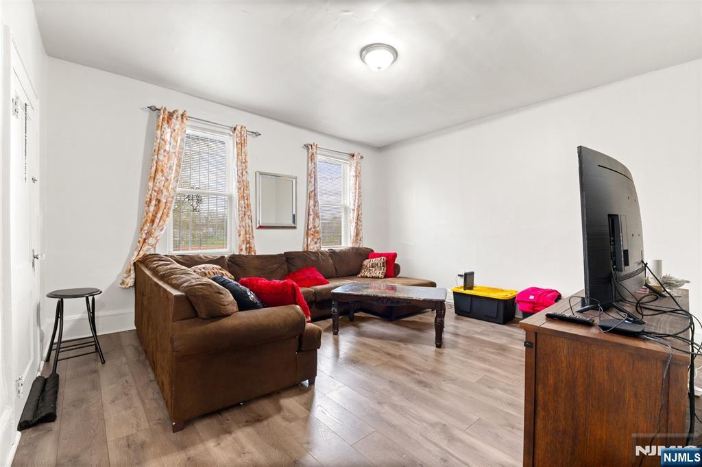 92 South Devine Street Newark, NJ 07106 - Photo 16 of 33 a living room with furniture and wooden floor