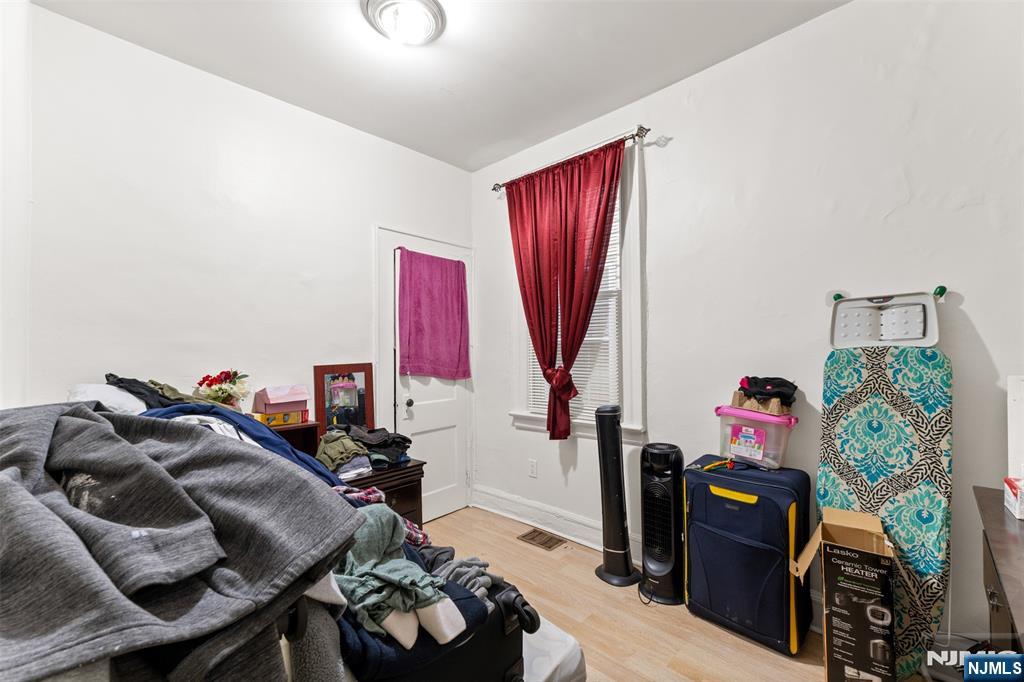 92 South Devine Street Newark, NJ 07106 - Photo 24 of 33 a living room with furniture and a wooden floor