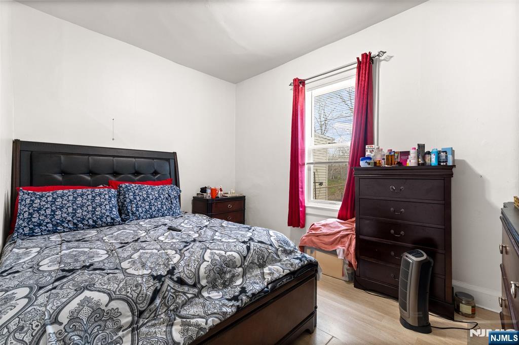 92 South Devine Street Newark, NJ 07106 - Photo 28 of 33 a bedroom with a bed and a dresser