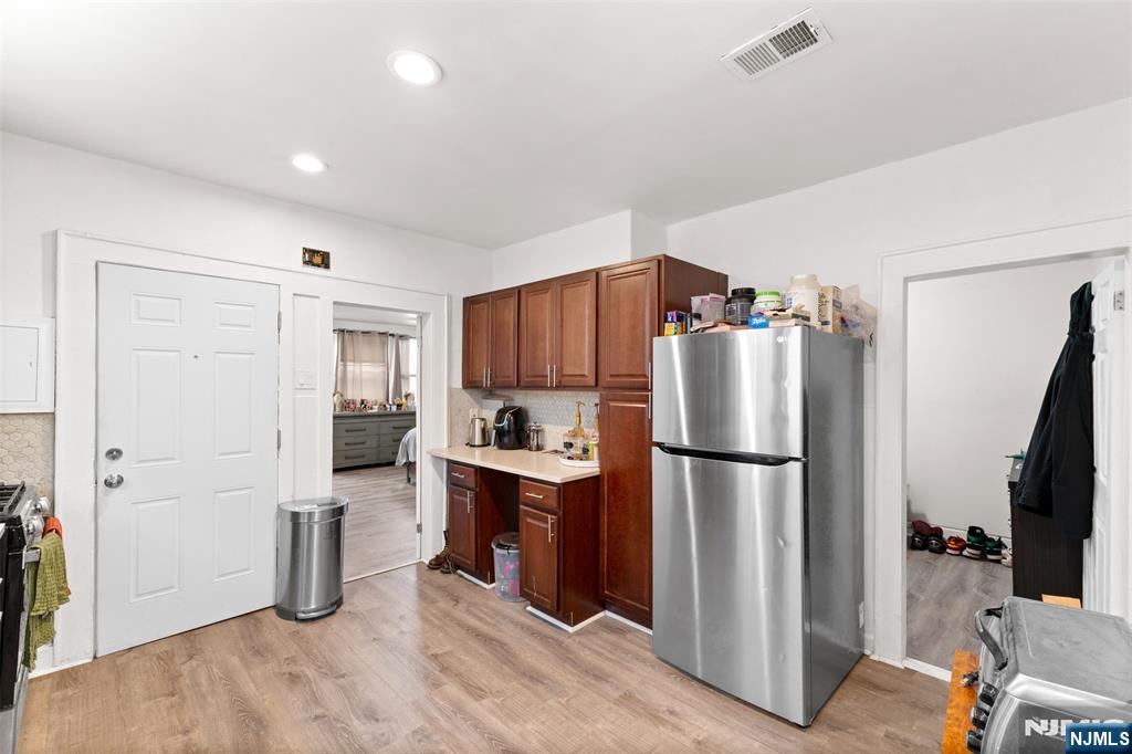 92 South Devine Street Newark, NJ 07106 - Photo 7 of 33 a kitchen with a refrigerator a stove and a sink