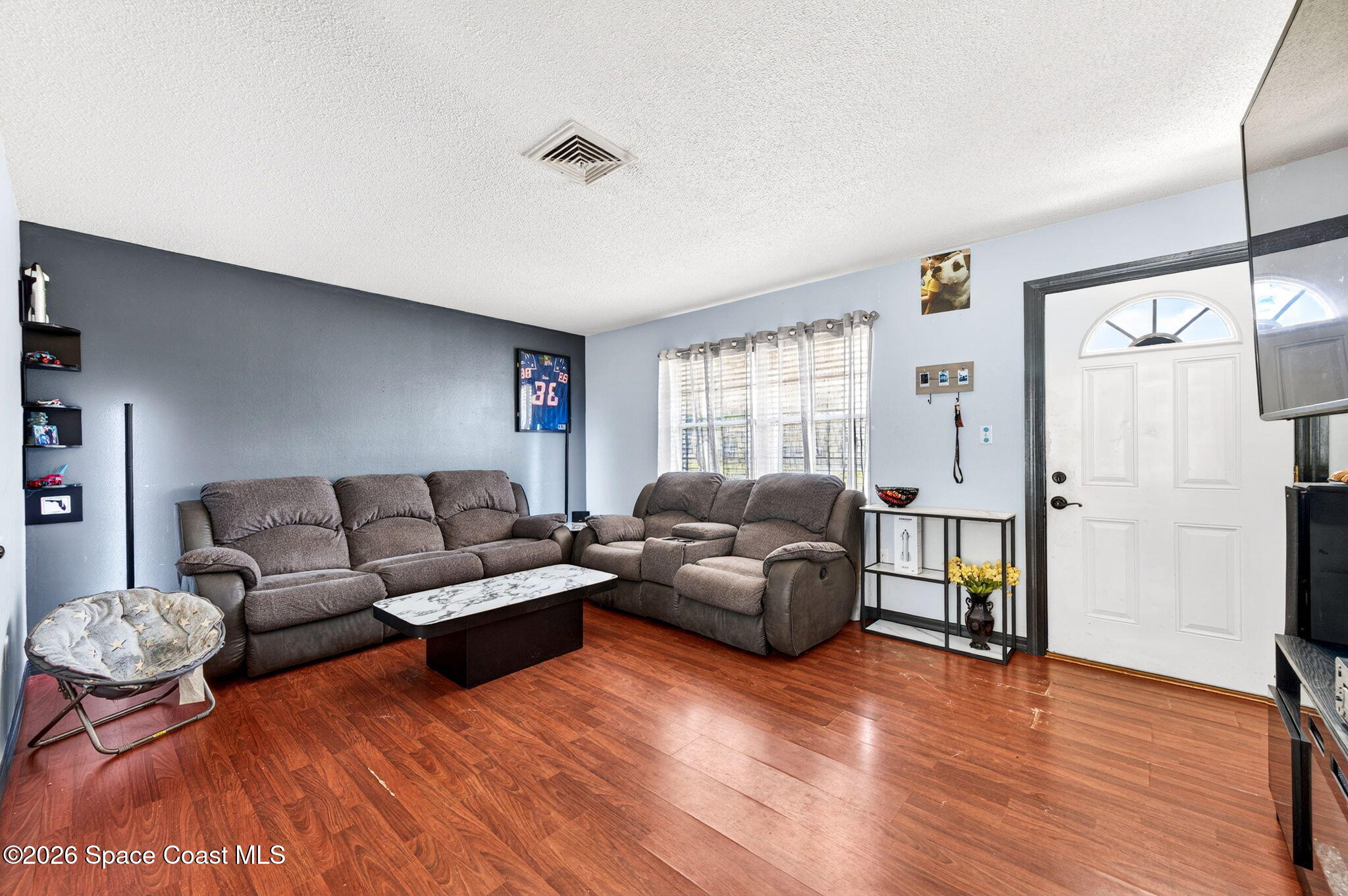 3300 Argyle Road Titusville, FL 32796 - Photo 15 of 29 a living room with furniture and a window