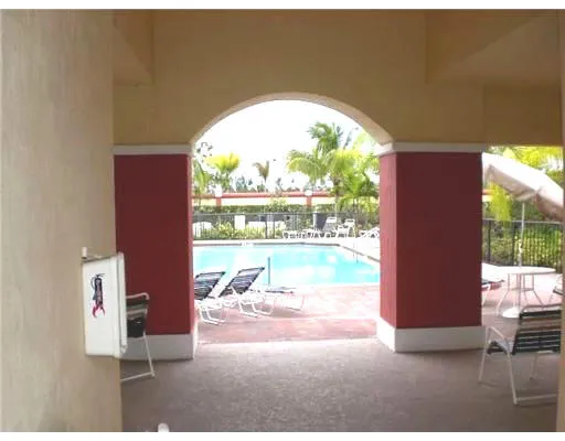 a view of a living room and floor to ceiling window