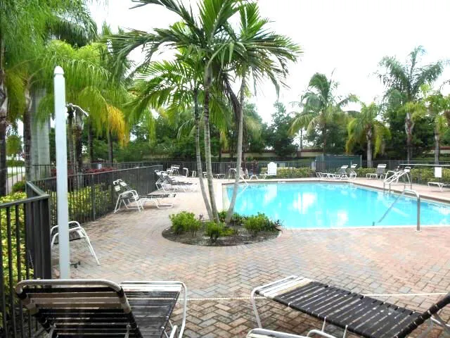 a view of a swimming pool with a patio