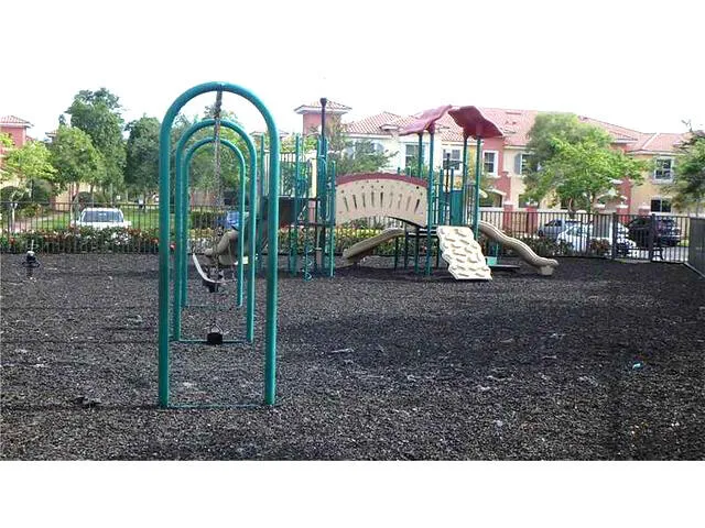 a black and white house with a yard