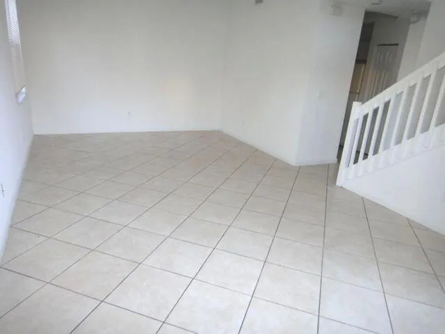 a view of an empty room and entryway