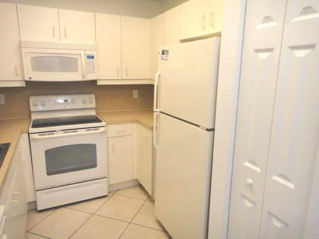 a kitchen with a stove and a microwave