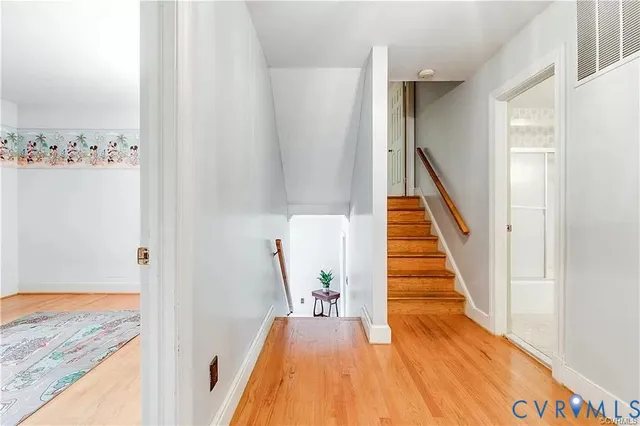 a spacious bedroom with a bed and a window
