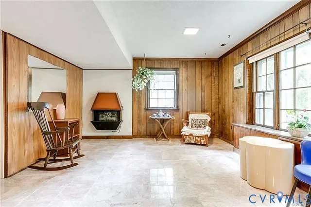 a kitchen with kitchen island granite countertop wooden cabinets and refrigerator