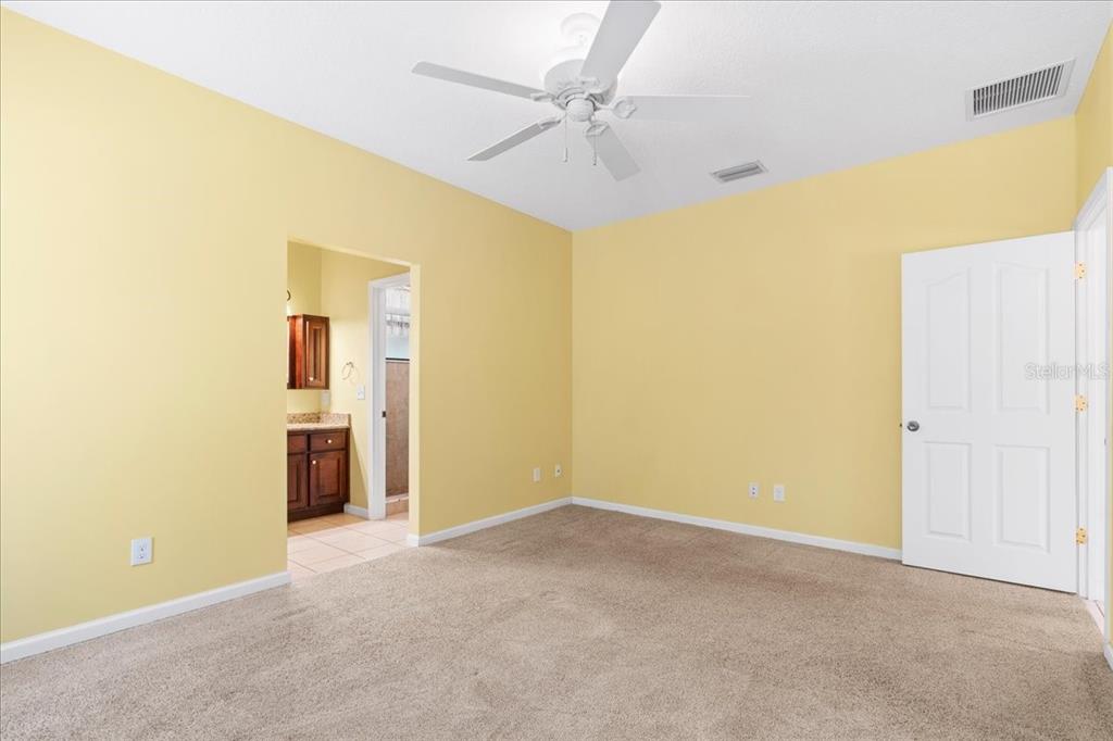 124 Mandarin Lake Road Melrose, FL 32666 - Photo 20 of 46 a view of a big room with windows and chandelier fan