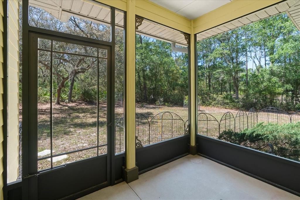 124 Mandarin Lake Road Melrose, FL 32666 - Photo 30 of 46 a view of a glass door with a balcony