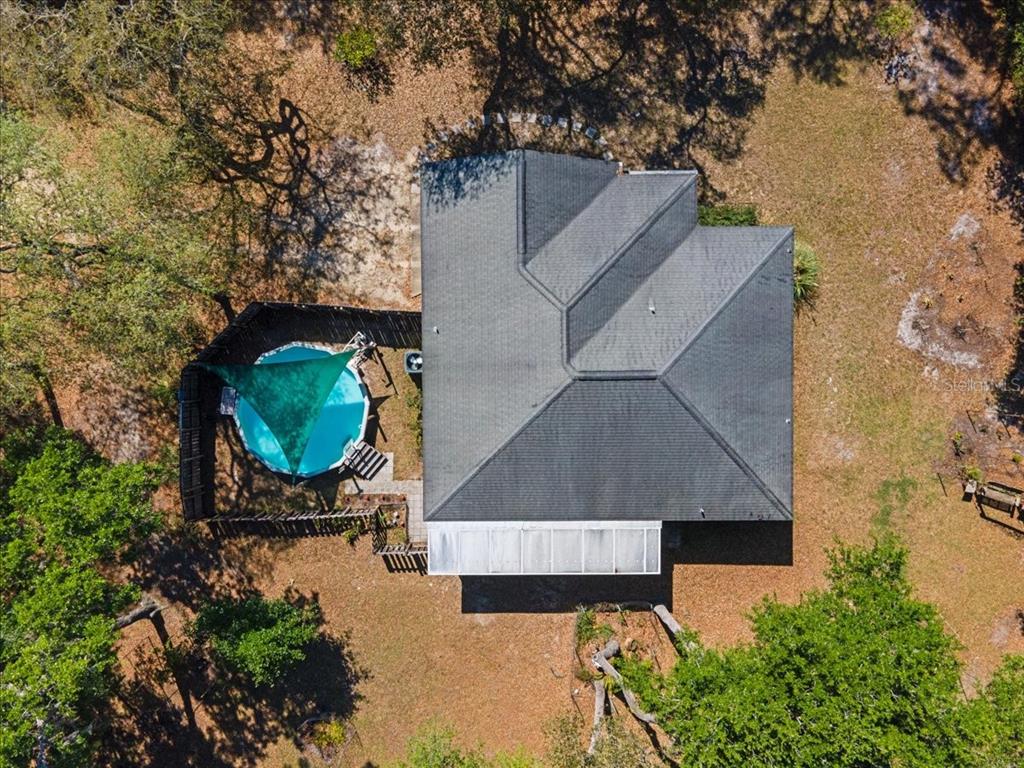 124 Mandarin Lake Road Melrose, FL 32666 - Photo 40 of 46 an aerial view of a house with swimming pool and porch