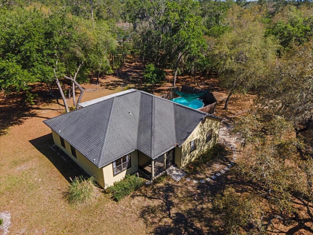 124 Mandarin Lake Road Melrose, FL 32666 - Photo 46 of 46 a aerial view of a house with a yard and trees