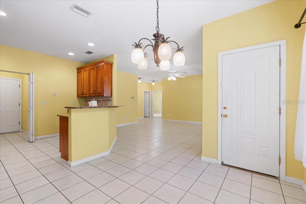 124 Mandarin Lake Road Melrose, FL 32666 - Photo 9 of 46 a view of a kitchen with furniture and an empty room