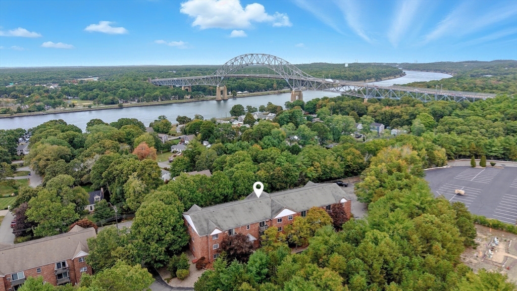 90-92 Sandwich Road, Unit 2D Bourne, MA 02532 - Photo 13 of 29 an aerial view of a house with a garden