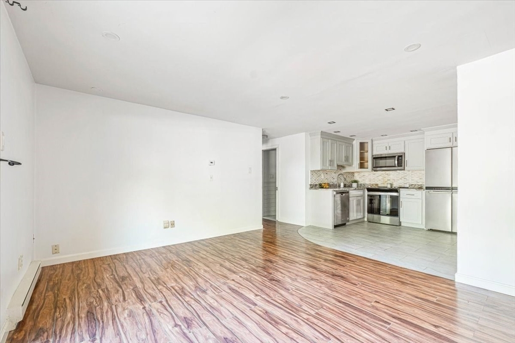 90-92 Sandwich Road, Unit 2D Bourne, MA 02532 - Photo 25 of 29 a view of a kitchen with wooden floor