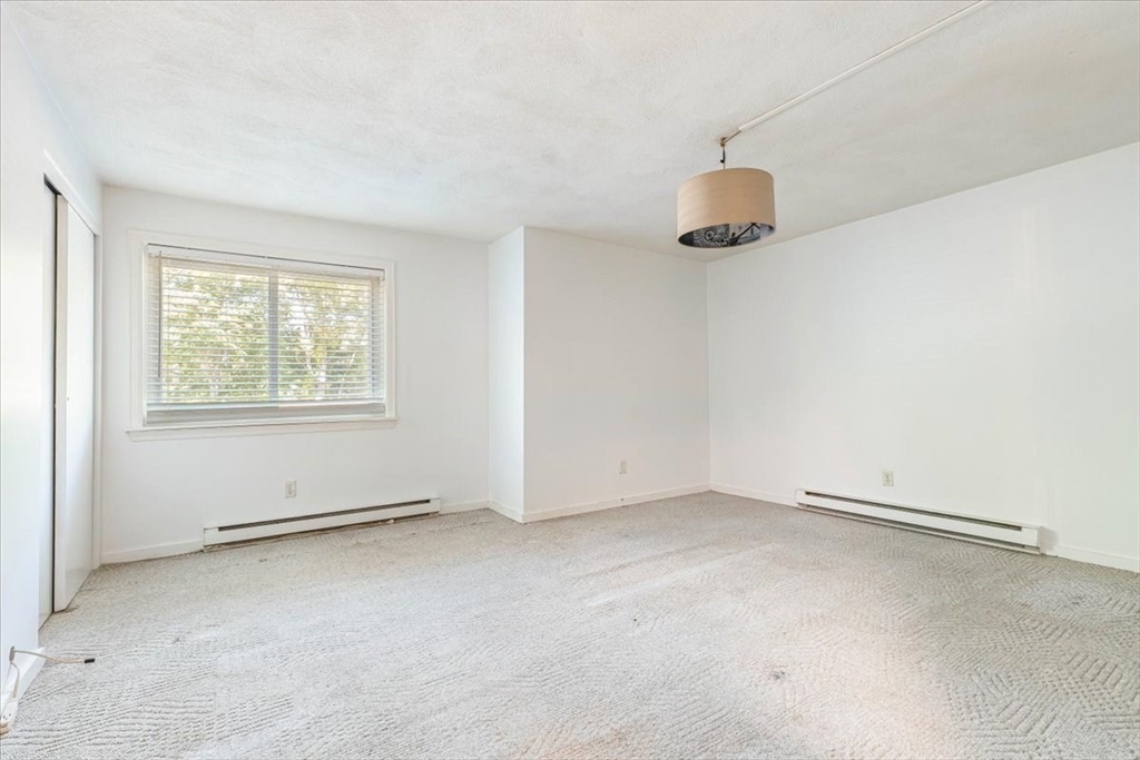 90-92 Sandwich Road, Unit 2D Bourne, MA 02532 - Photo 4 of 29 an empty room with windows