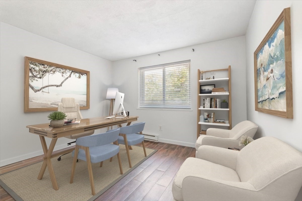90-92 Sandwich Road, Unit 2D Bourne, MA 02532 - Photo 5 of 29 a workspace with furniture window and wooden floor