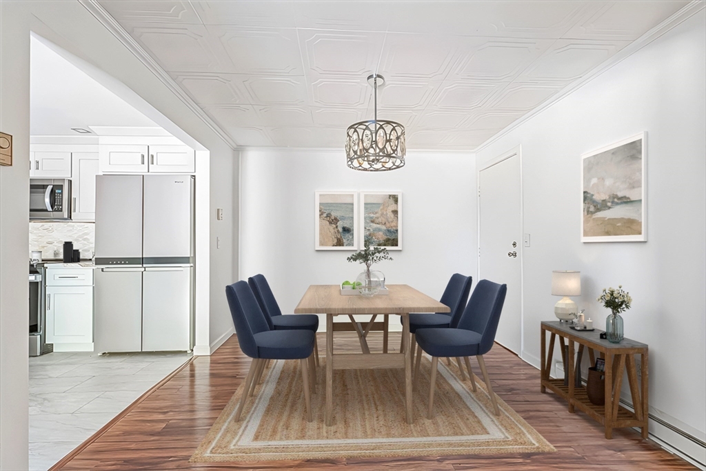 90-92 Sandwich Road, Unit 2D Bourne, MA 02532 - Photo 7 of 29 a view of a dining room with furniture