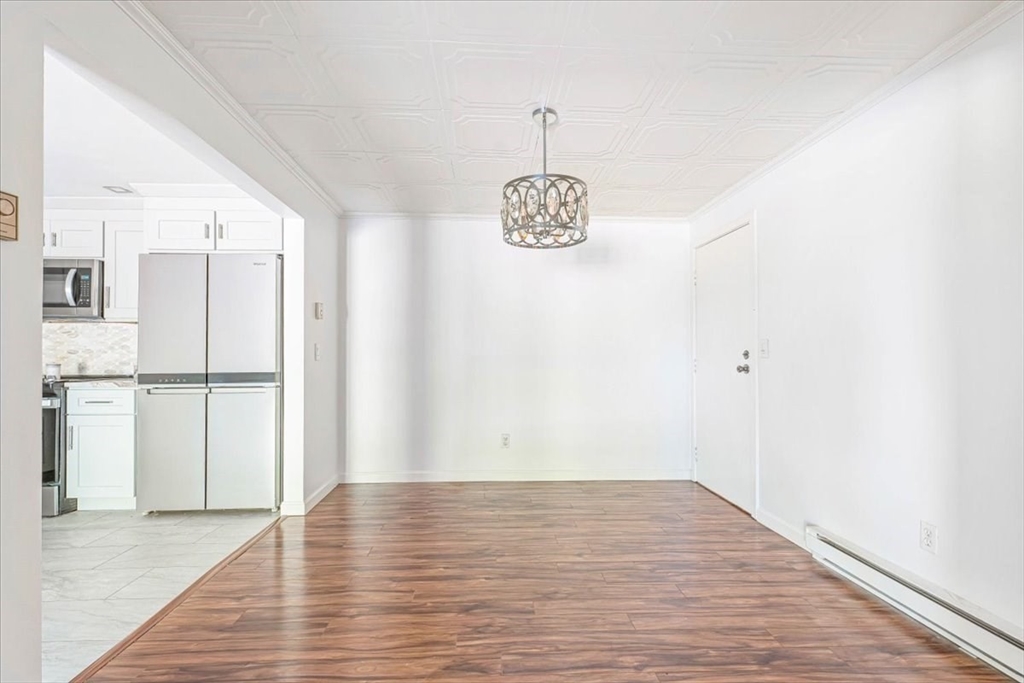 90-92 Sandwich Road, Unit 2D Bourne, MA 02532 - Photo 8 of 29 a view of empty room with wooden floor